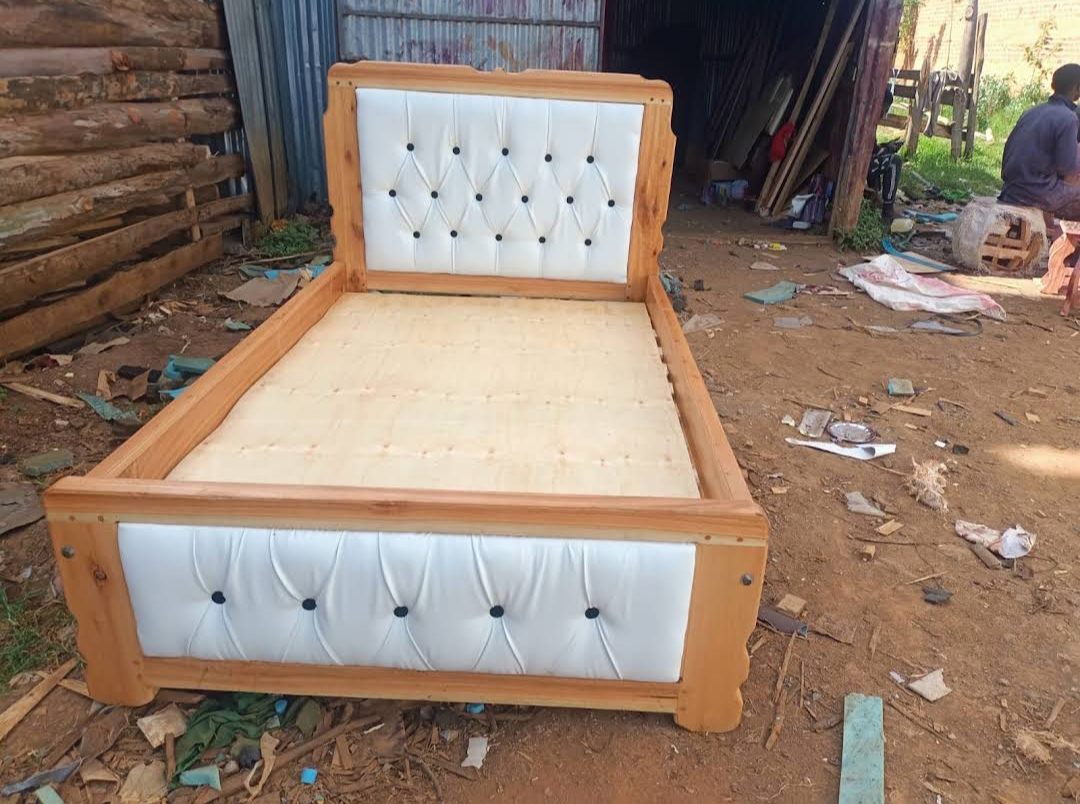 Cedar bed with white buttoned padded panels