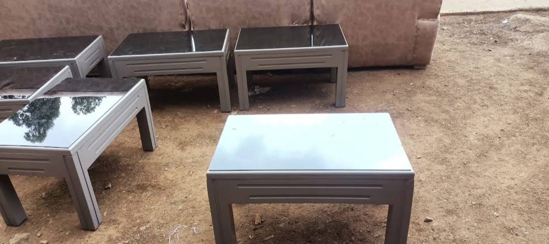 Grey glass-top coffee and side tables
